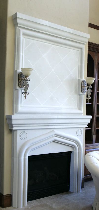 Cast Stone fire place with accent detail.