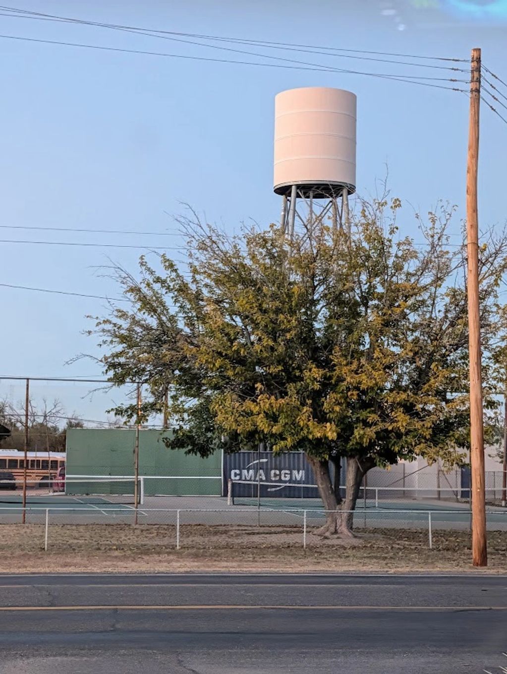 This looks like a water tower, but it is a Verizon cellular tower at the school