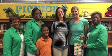 Psi Chapter members celebrate the principle and teachers at Stultz Road Elementary School.