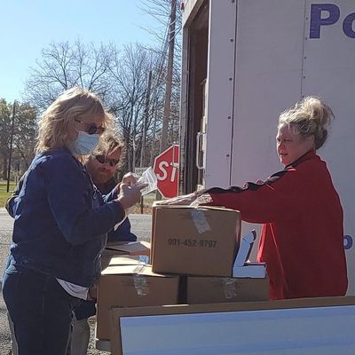 Volunteers unloading donated food to Portland Pay it Forward, a Food Pantry in Portland, TN