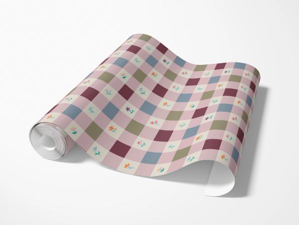 Rolled wallpaper with a multicolored checkered floral pattern.