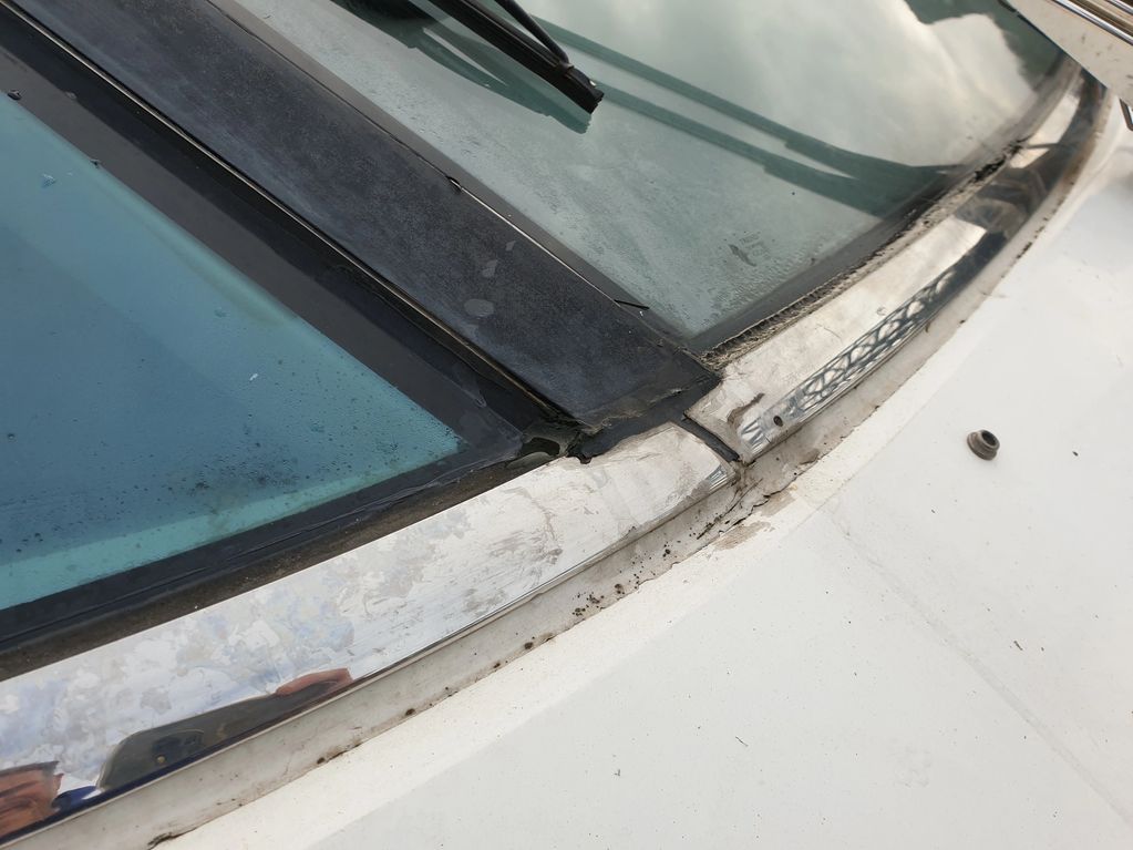 Tired old sealant on a Fairline Squadron 58