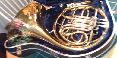 Blurry photo of a french horn