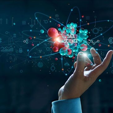 Hand holding a digital representation of data science concepts with atoms and data points.