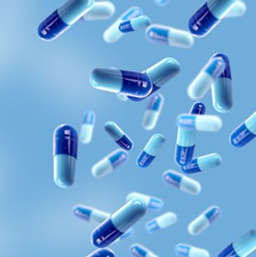 Blue and white capsules floating against a soft blue background.