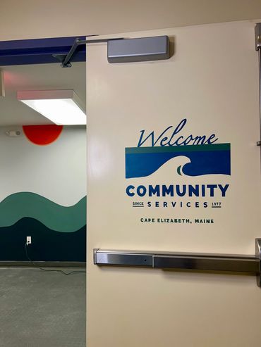 Welcome signage on door