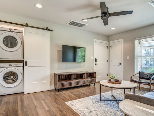 In-unit washer and dryer and mounted television