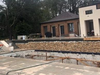 Tearing down an old pool and putting a brand new pool in. New pool design. Removing old pool.