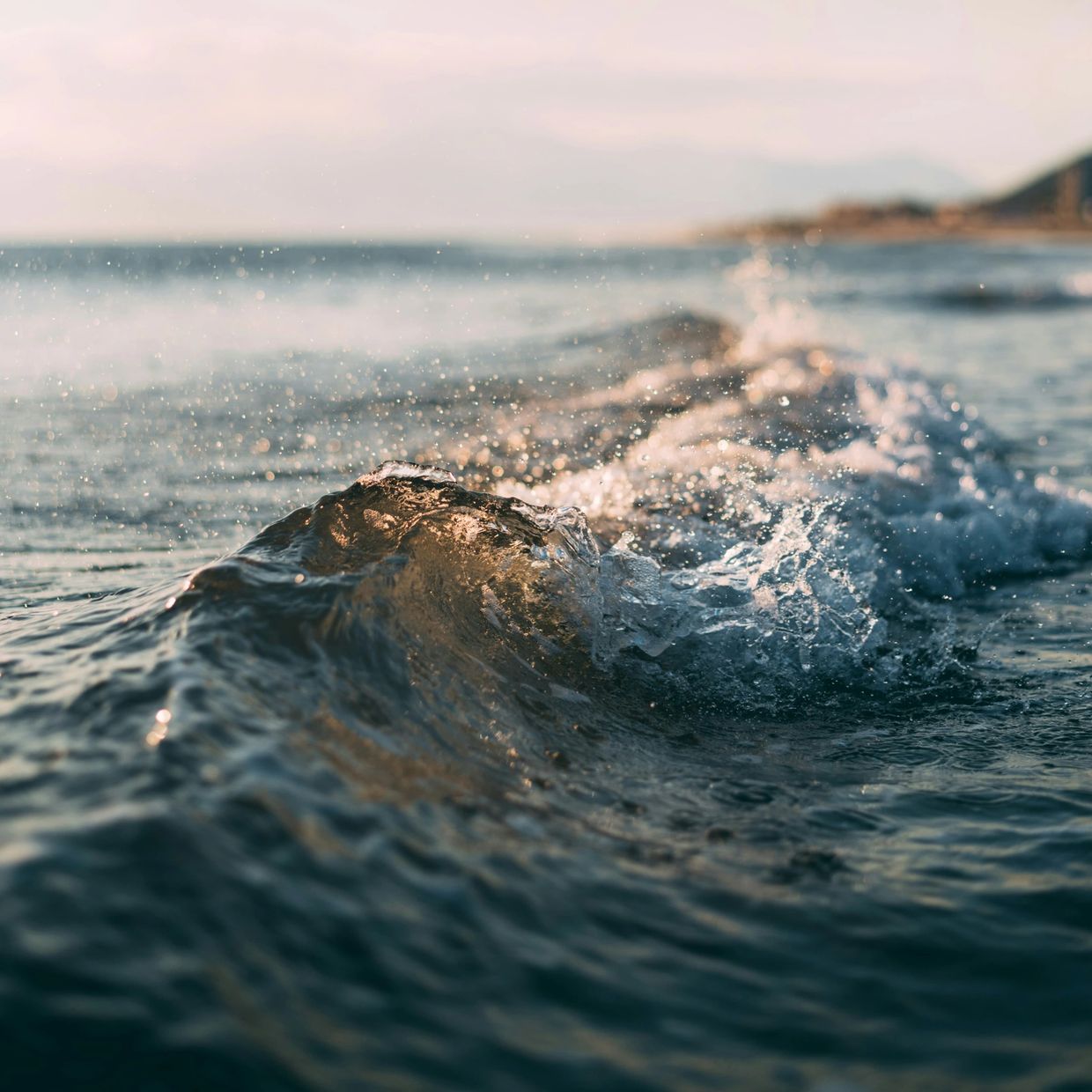 Alt text: “Gentle ocean waves at sunset symbolising calm, healing, and emotional growth.”