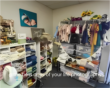 A White Color Cupboard With Racks Of Clothes