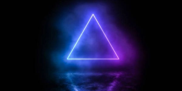 Glowing neon triangle with blue and purple mist on a reflective surface.