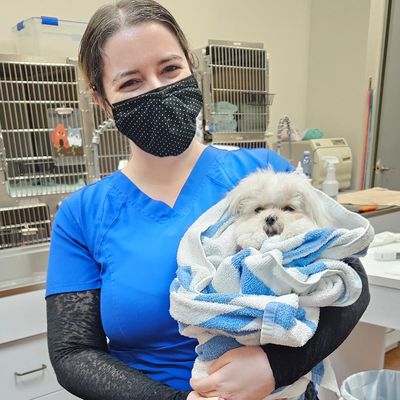 A tech holding a patient