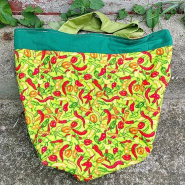green tote bag with hot chili peppers on the fabric
