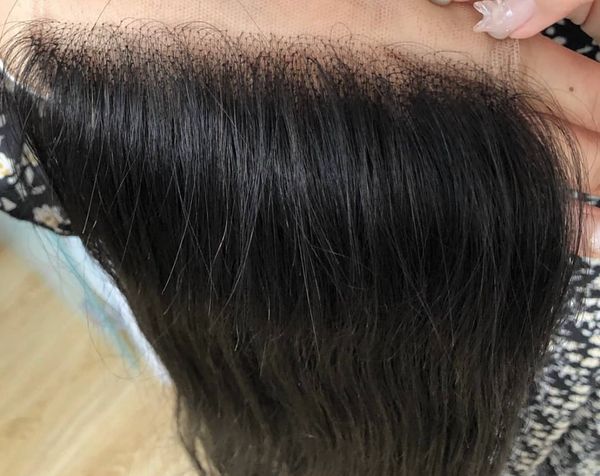 Small knots, close up shot of lace closure before knots are bleached.