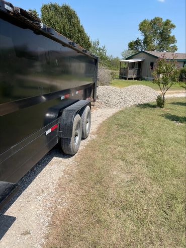 Delivery of crushed concrete for driveway resurfacing.