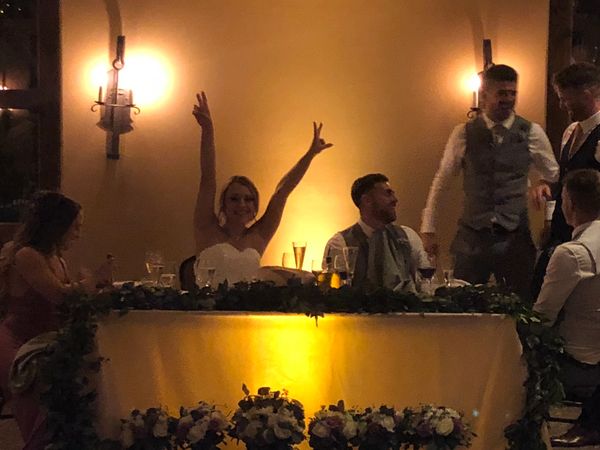 Decorative uplighting beneath the Sweetheart table, which is visible during dinner, becomes sound-ac
