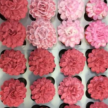 These cupcakes with intricate flowerettes were made by All About the Cake.