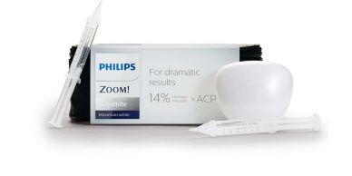 Philips Zoom teeth whitening kit with syringes and a white dental model.