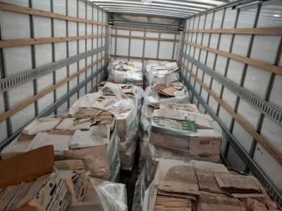 Truck load of pallets with boxes of paper that will be recycled into toilet paper.