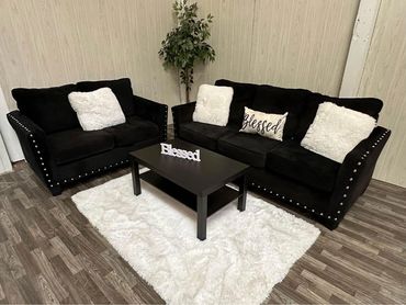 Couch with three pillows and table