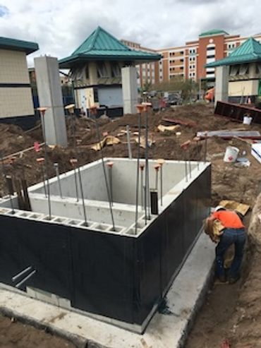 Worker building concrete foundation