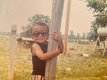 Little Mark with Glasses Holding Tree