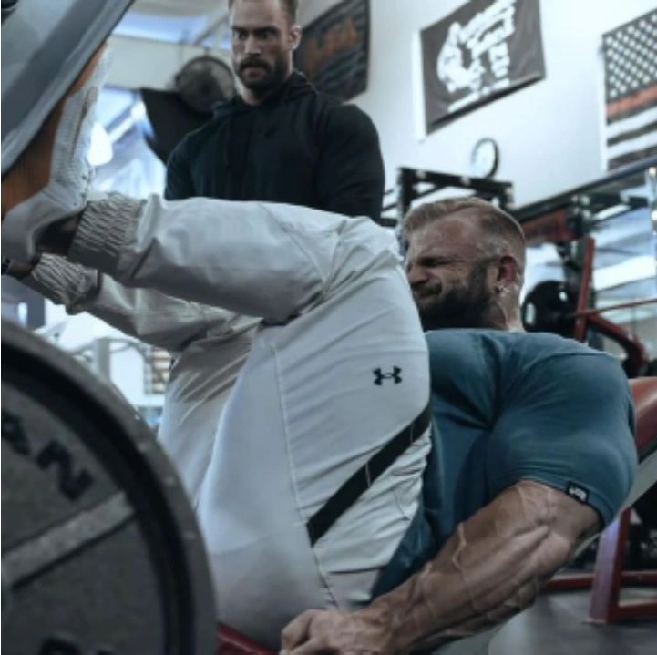 Bodybuilders Chris Bumstead and Iain Vailliere train legs at Kissimmee Muscle Gym