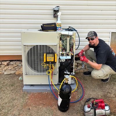 Technician repairing ac unit in Sarasota Florida