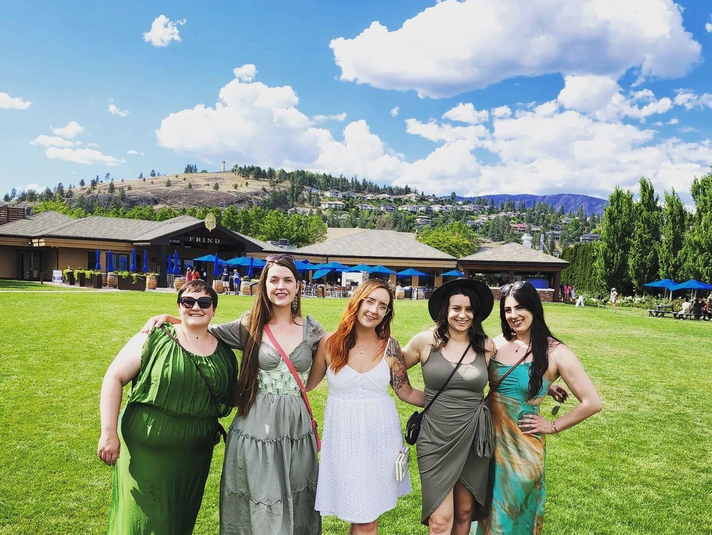 A group of 5 women standing in front of Frind Winery.
