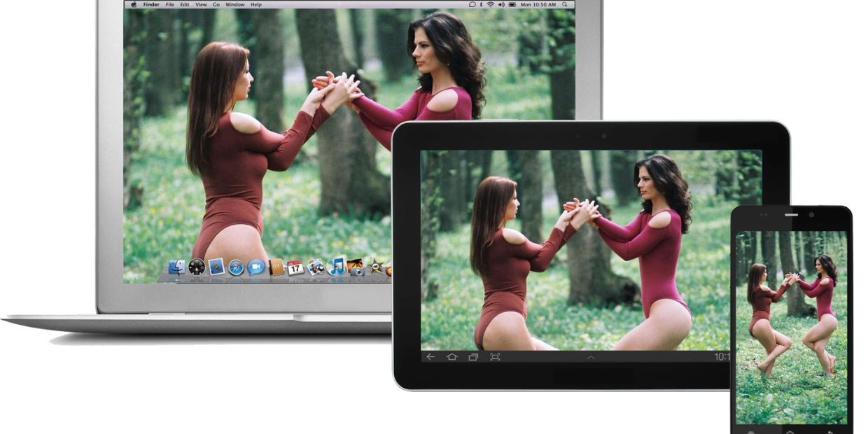 Two women in matching outfits holding hands, shown on laptop, tablet, and phone screens.