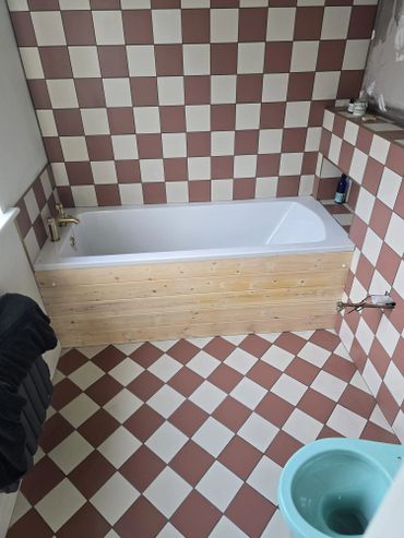 Finished pine bath panel with added niche for shampoos etc