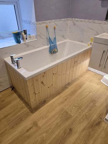 finished floor and timber tongue and groove bath panelling