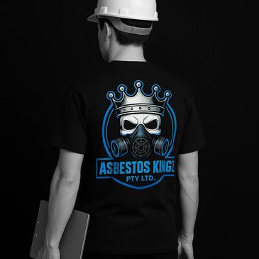 Man in a hard hat wearing a black shirt with a gas mask crown logo and "ASBESTOS KINGZ PTY LTD." text.