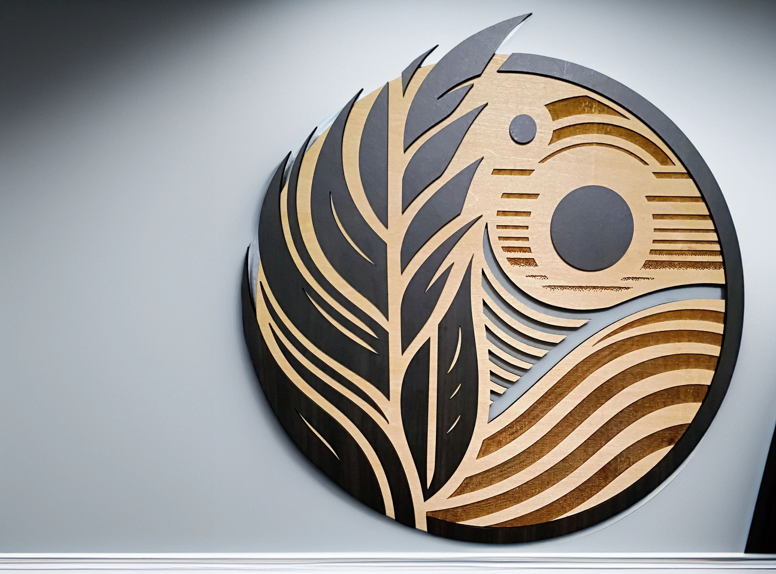 Leaf and Sun motif wall decor art made with Basswood and faux ivory maple. LAser engraved and cut