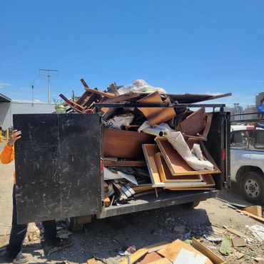 Dump trailer full of junk. Construction debris cleanup.
