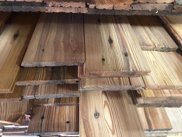 Stacked wooden planks with natural grain and knots.