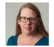 Portrait of a woman with glasses and long hair wearing a teal top.