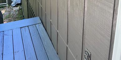 Painting of siding on a residential home after wood rot repaired