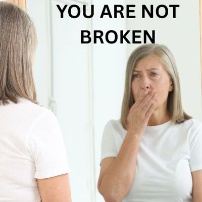 Woman looking in mirror