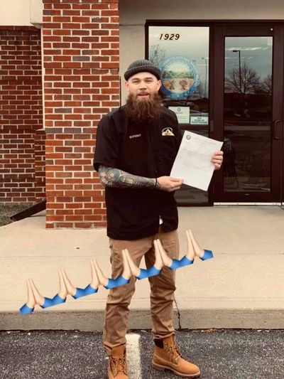 Our student posing in Columbus with his brand new license.