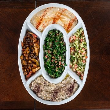 Caroun mix appetizer
Includes homemade hummus, baba ganoush, tabbouleh, Iraqi salad, and eggplant sa