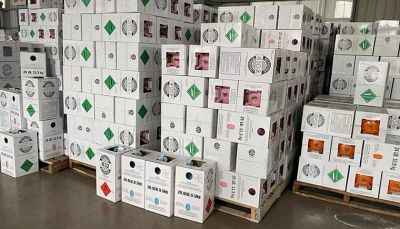 Stacks of packaged goods on pallets in a warehouse setting.