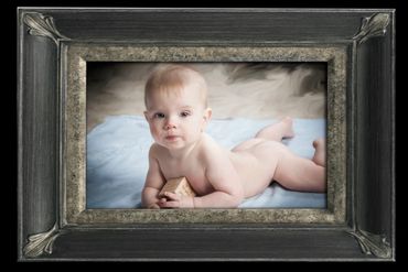fine art painted portrait of baby on belly