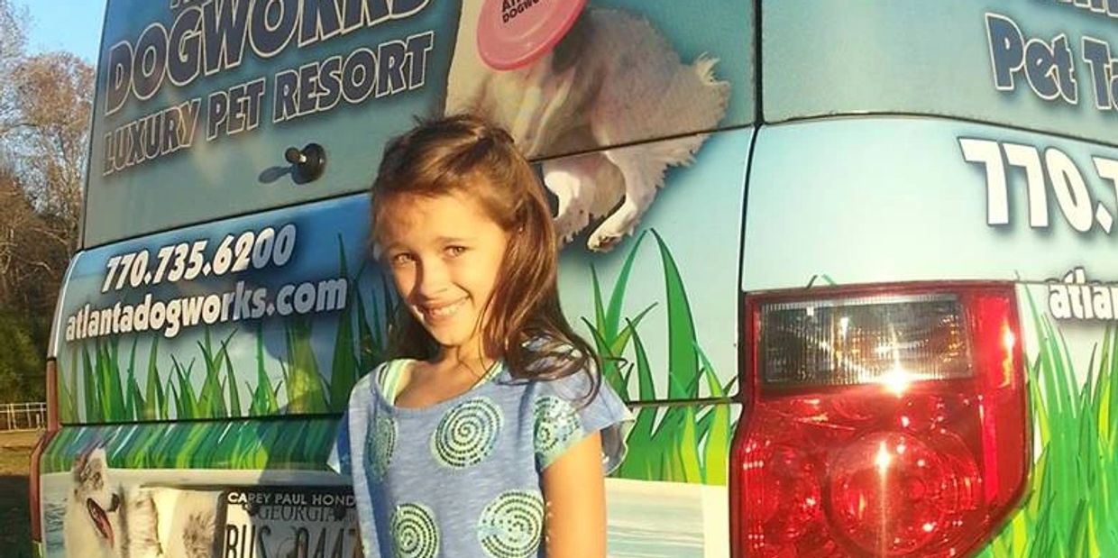 A girl giving still for picture