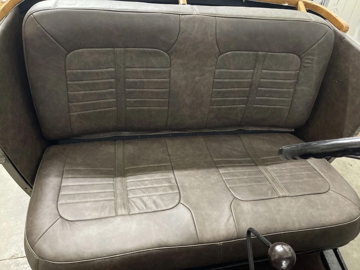Our custom leather car seat upholstery completed this design