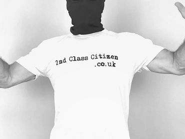 Man wearing a Balaclava with a political T Shirt