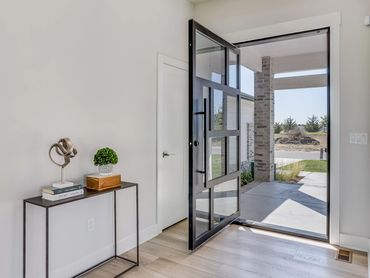 the inside view of an open modern style pivot door