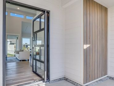 An open modern pivot door
