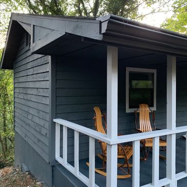 cabin surrounded by pine trees at Loblolly Pines Adventure Camp
