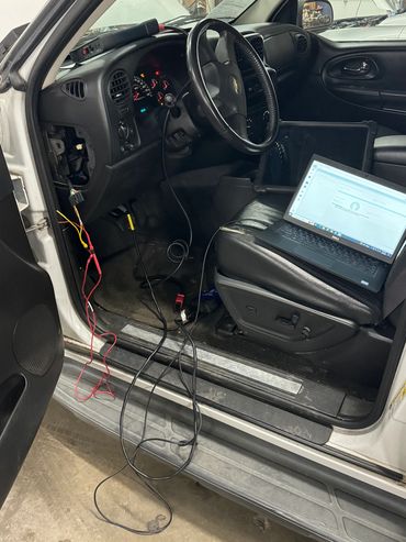 Using a laptop programming a Chevrolet truck engine control module